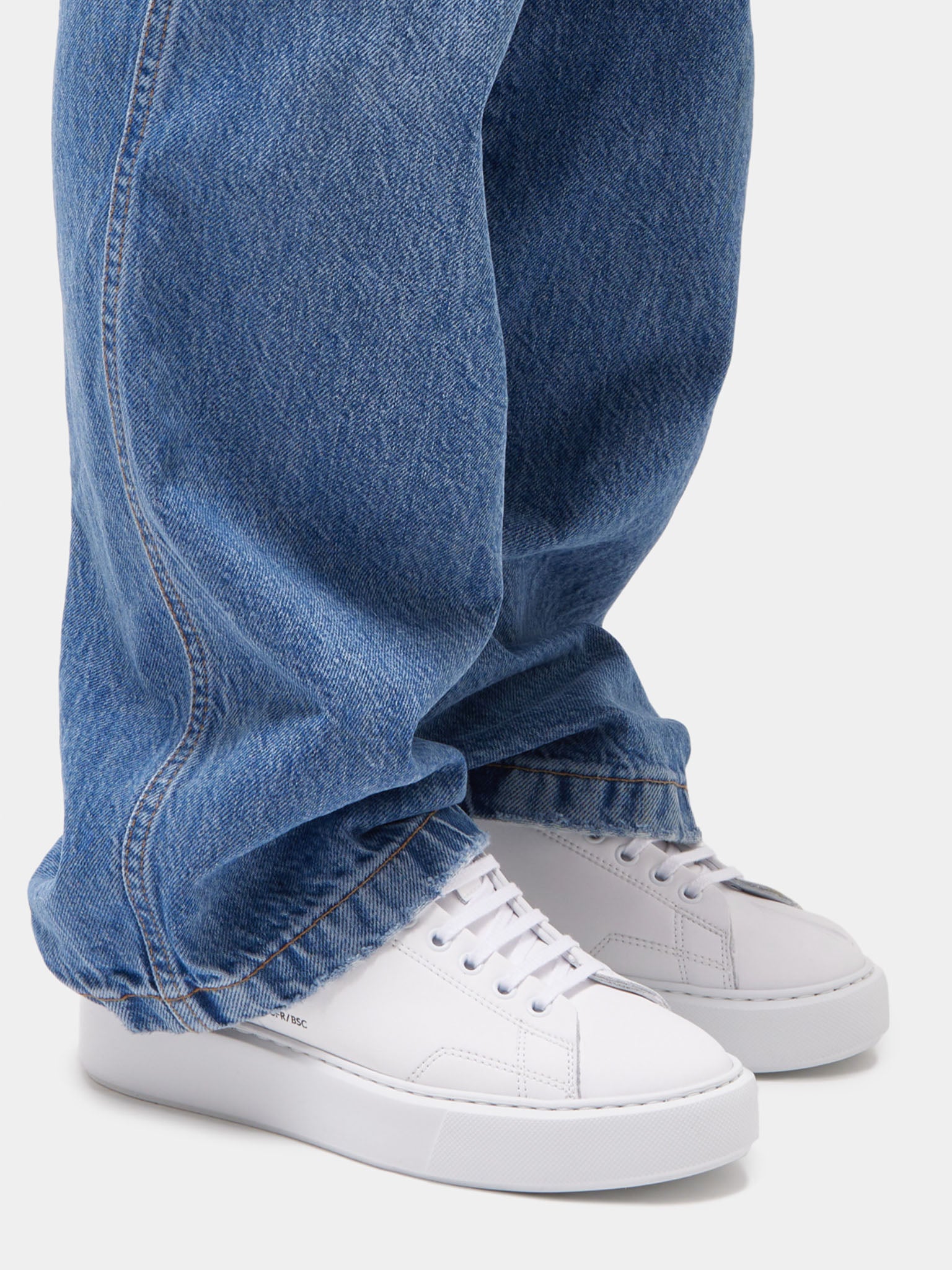 D.A.T.E Sfera Calf White Trainers on model wearing blue jeans