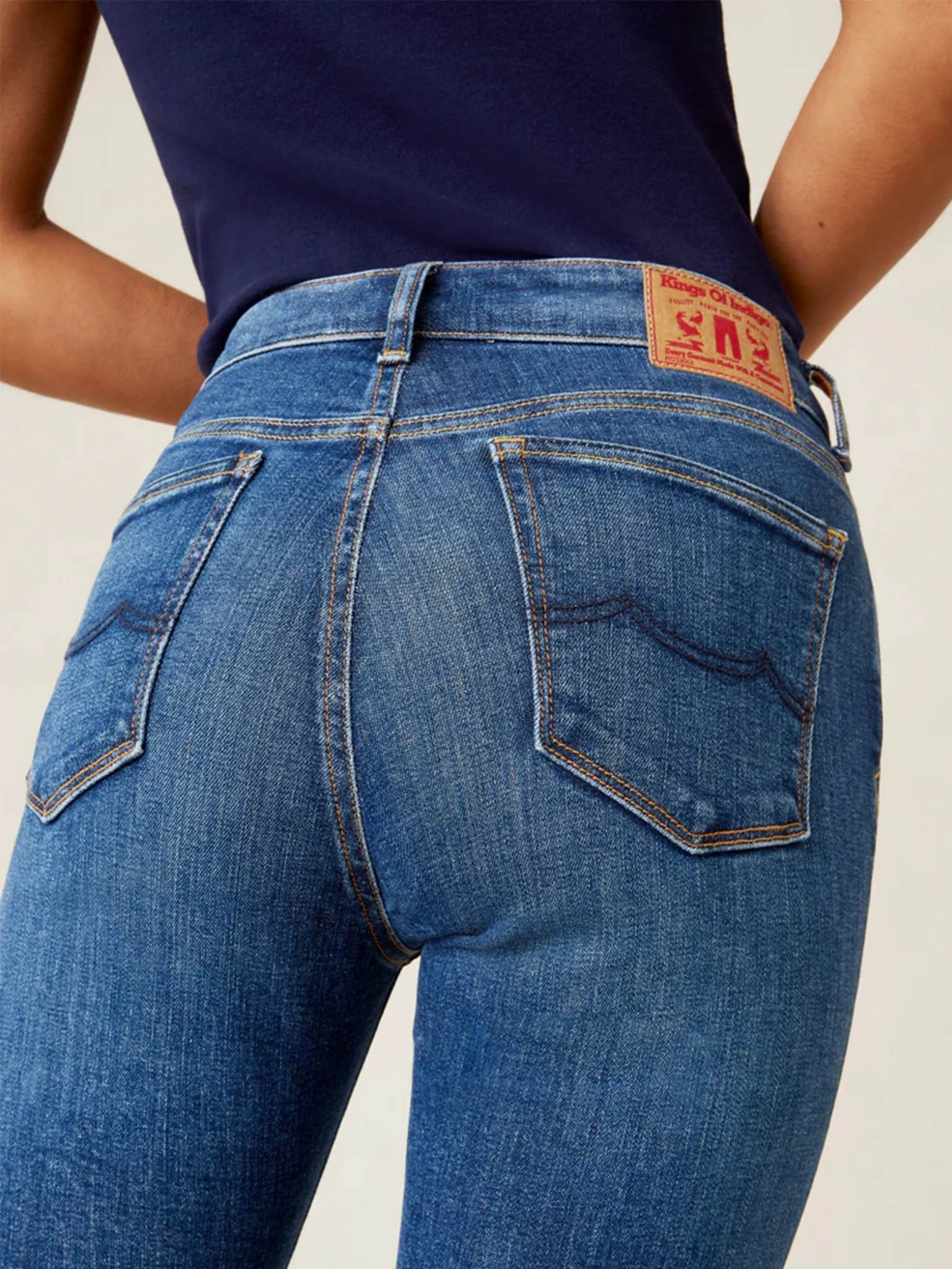 Kings of Indigo Juno Medium Rise Jeans on model closeup of bum