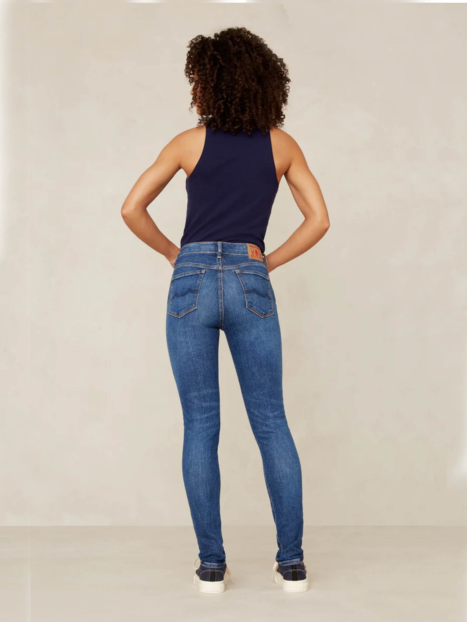Kings of Indigo Juno Medium Rise Jeans on model from back