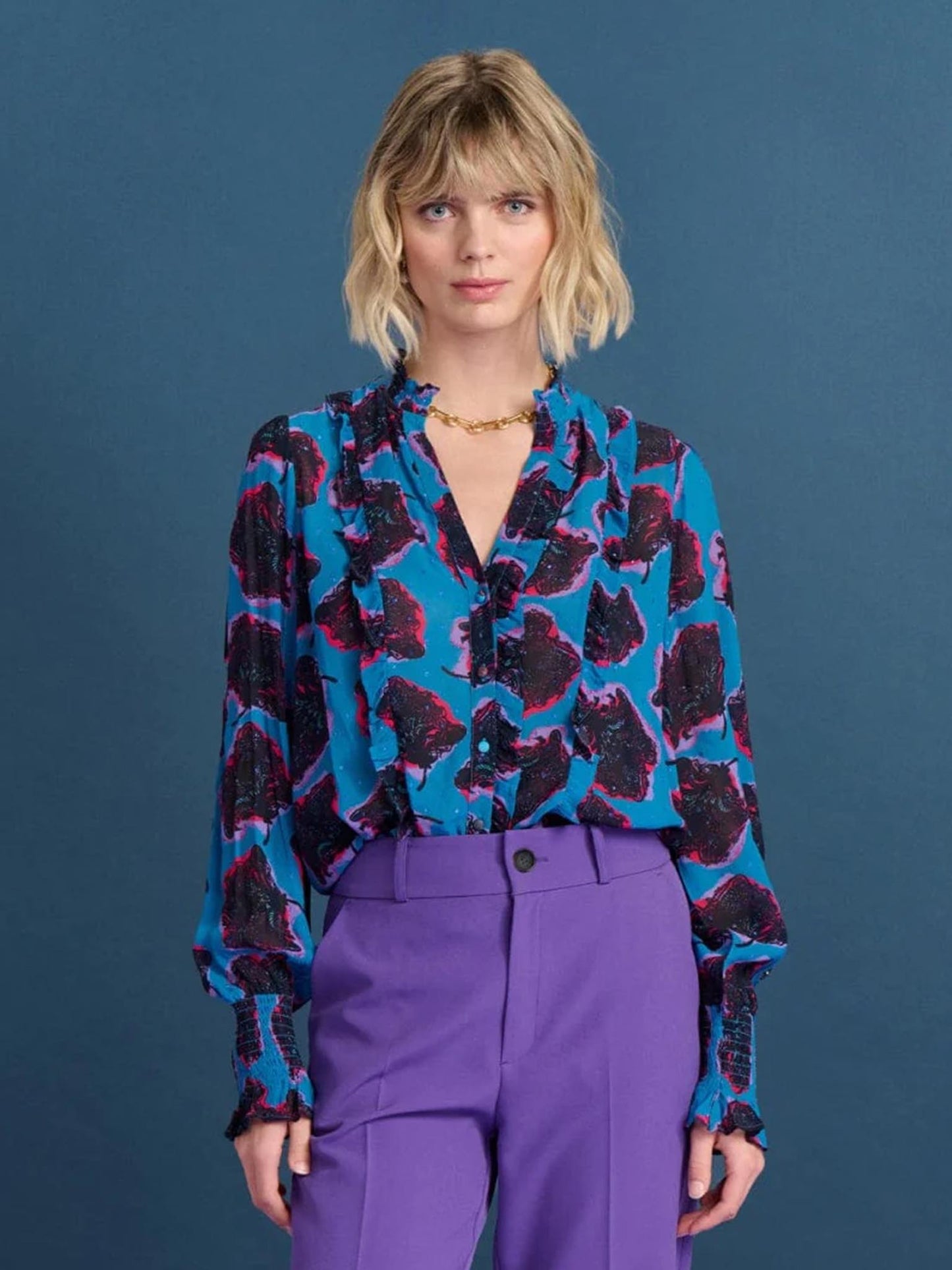 POM Amsterdam Flower Pop Blue Shirt from the front paired with purple trousers